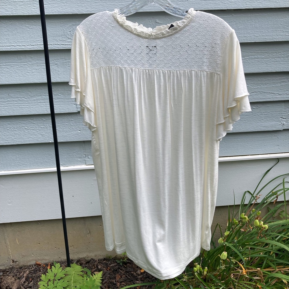 Cream colored top, size Large. Never worn.